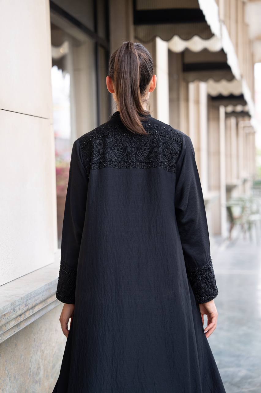 Linen abaya in black with hand embroidery and beading. C:1089