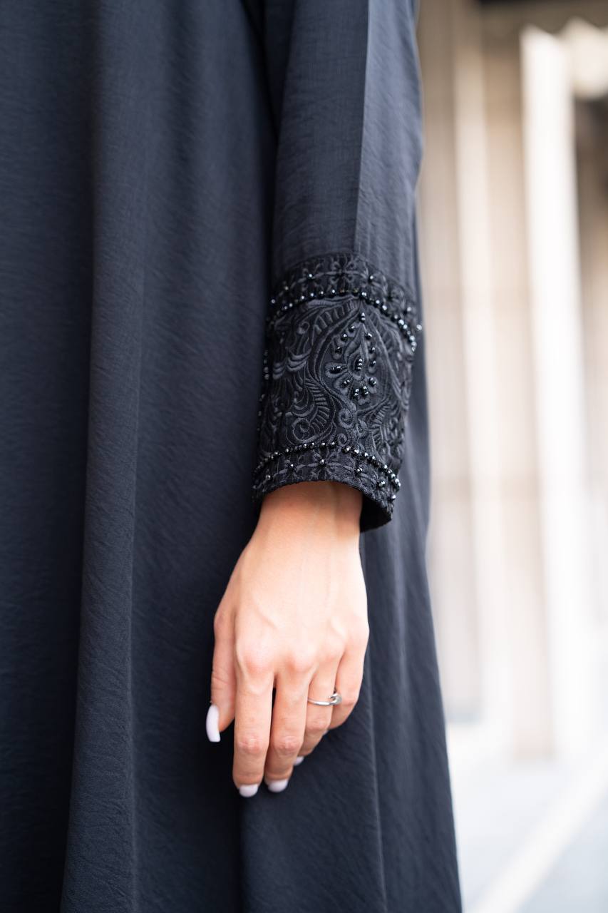 Linen abaya in black with hand embroidery and beading. C:1089