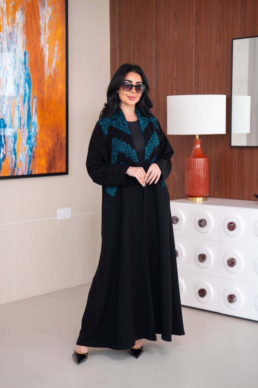 Black crepe abaya with blue embroidery.C;1045