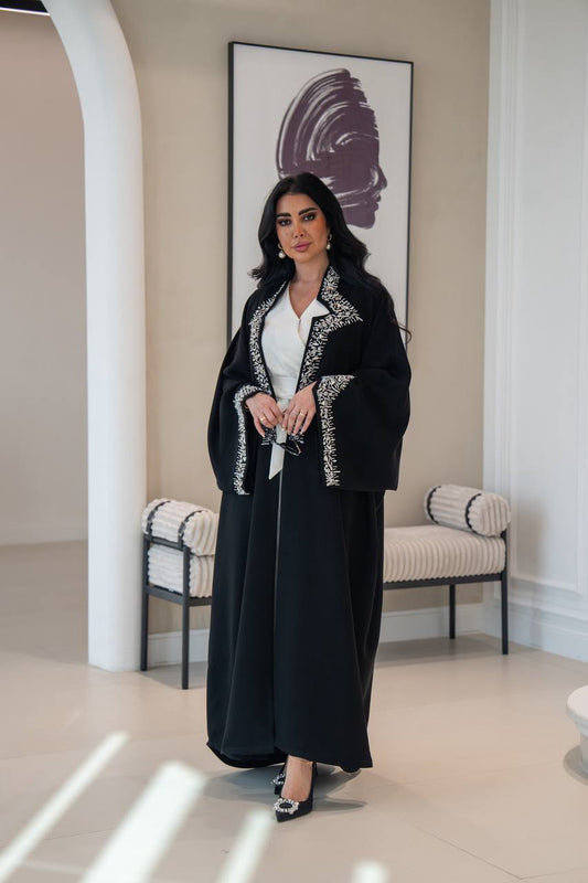 Black crepe abaya with hand-stitched details.C;1048