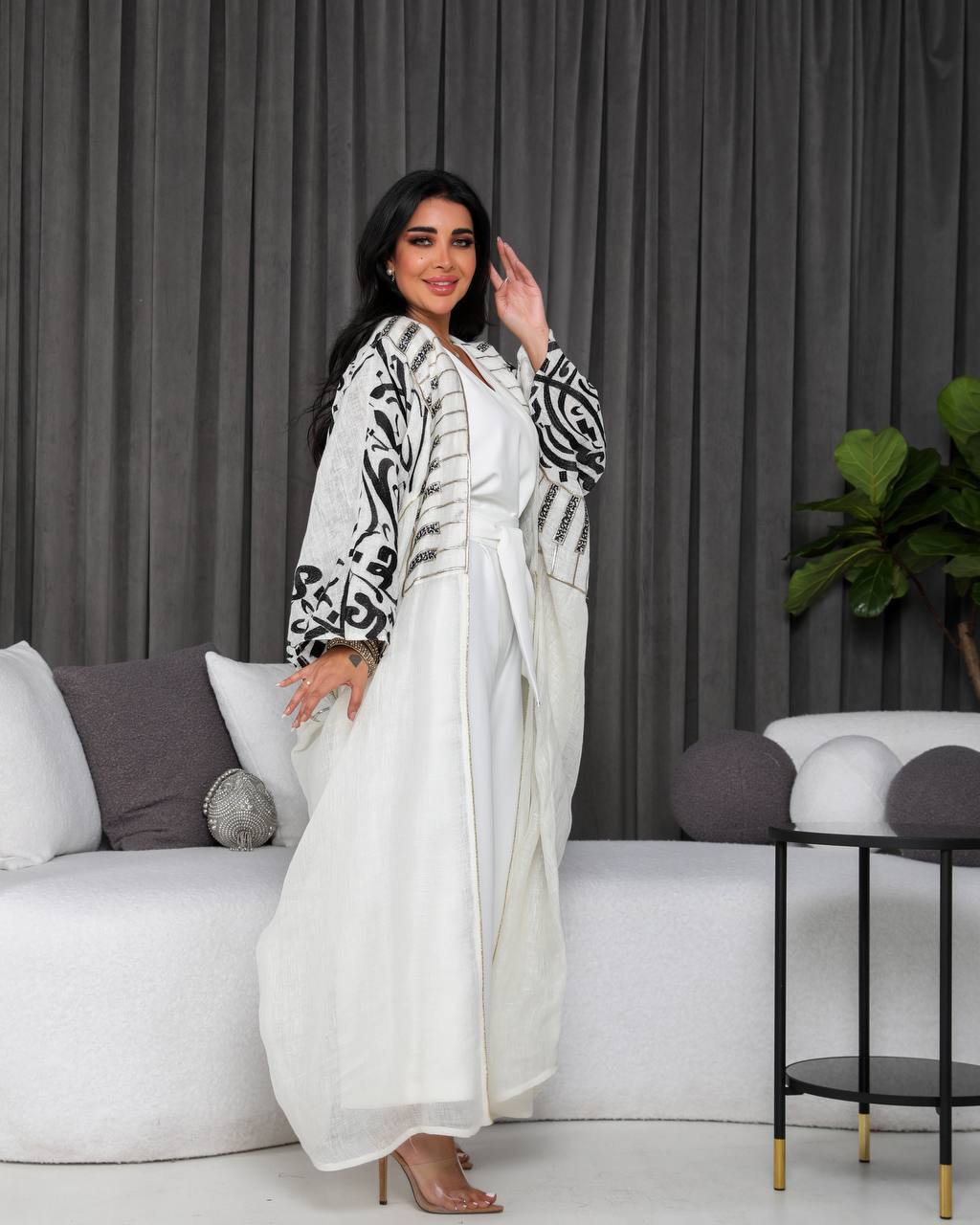 A white bisht with embroidery.C;1055