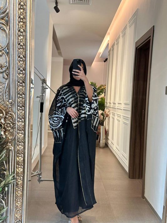 A black burlap cloak