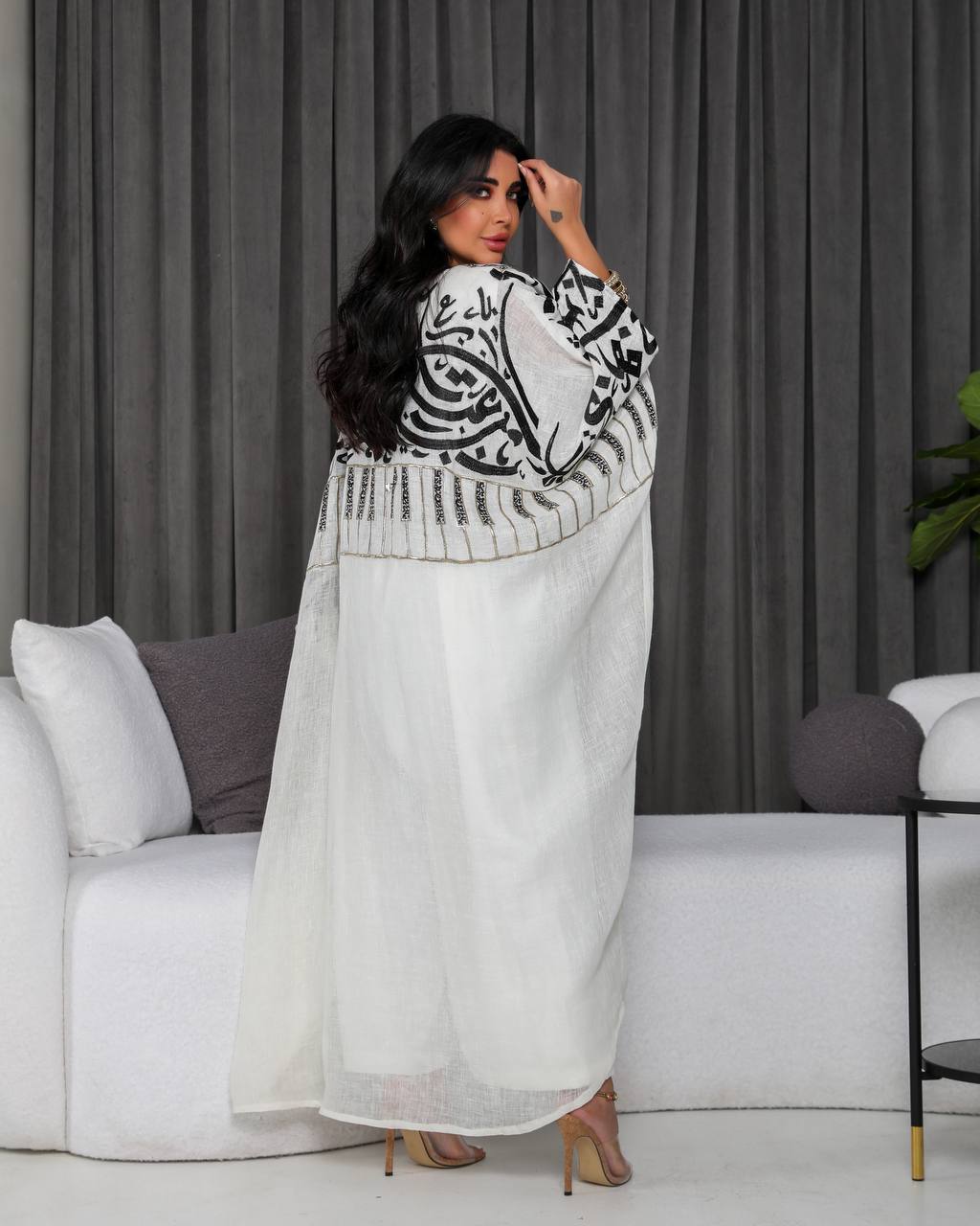 A white bisht with embroidery.C;1055
