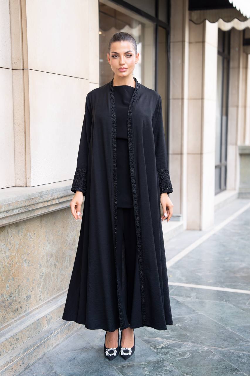 Linen abaya in black with hand embroidery and beading. C:1089