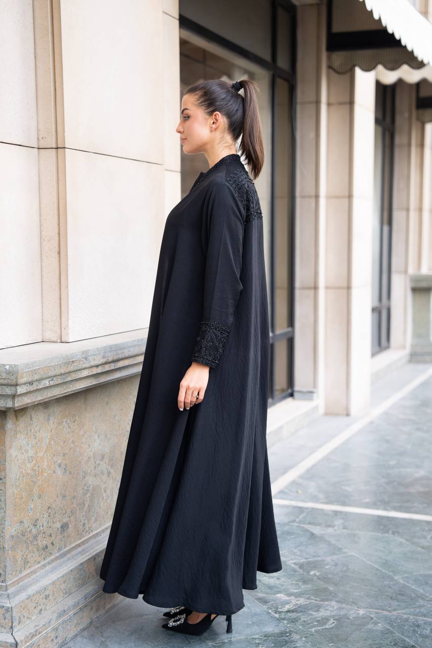 Linen abaya in black with hand embroidery and beading. C:1089