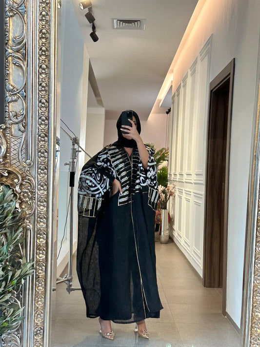 A black burlap cloak