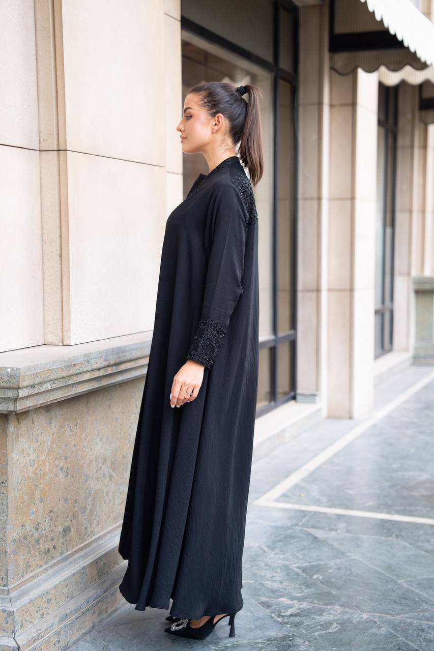 Linen abaya in black with hand embroidery and beading. C:1089