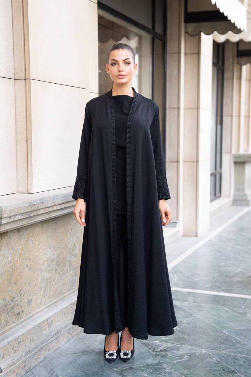 Linen abaya in black with hand embroidery and beading. C:1089