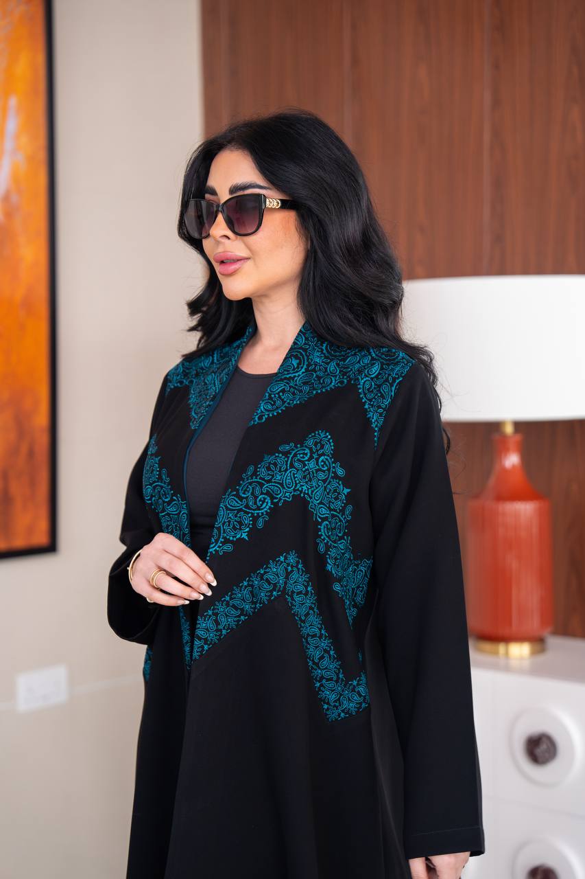 Black crepe abaya with blue embroidery.C;1045