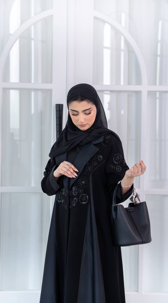 Crepe abaya with satin and hand-beaded details.C:1080