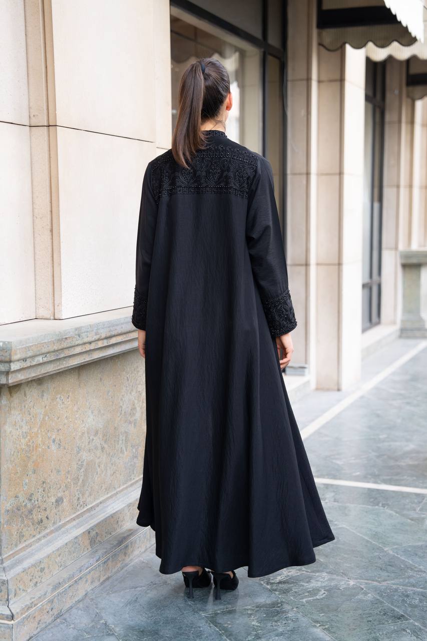 Linen abaya in black with hand embroidery and beading. C:1089