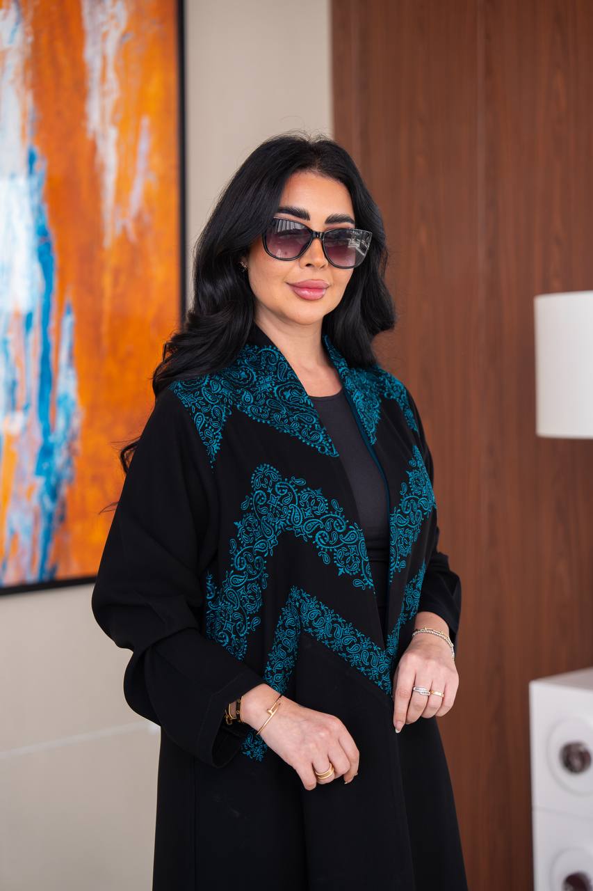 Black crepe abaya with blue embroidery.C;1045