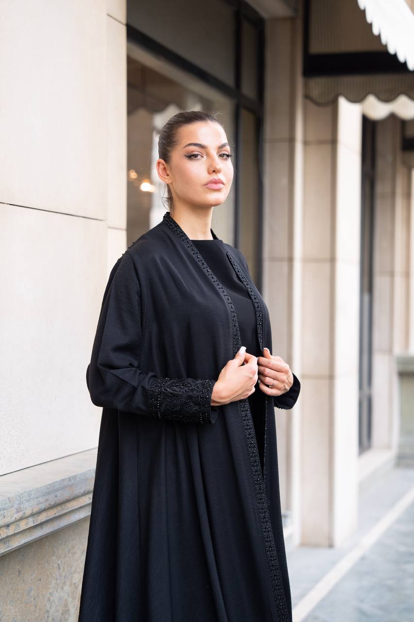 Linen abaya in black with hand embroidery and beading. C:1089