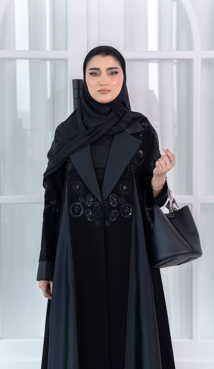 Crepe abaya with satin and hand-beaded details.C:1080