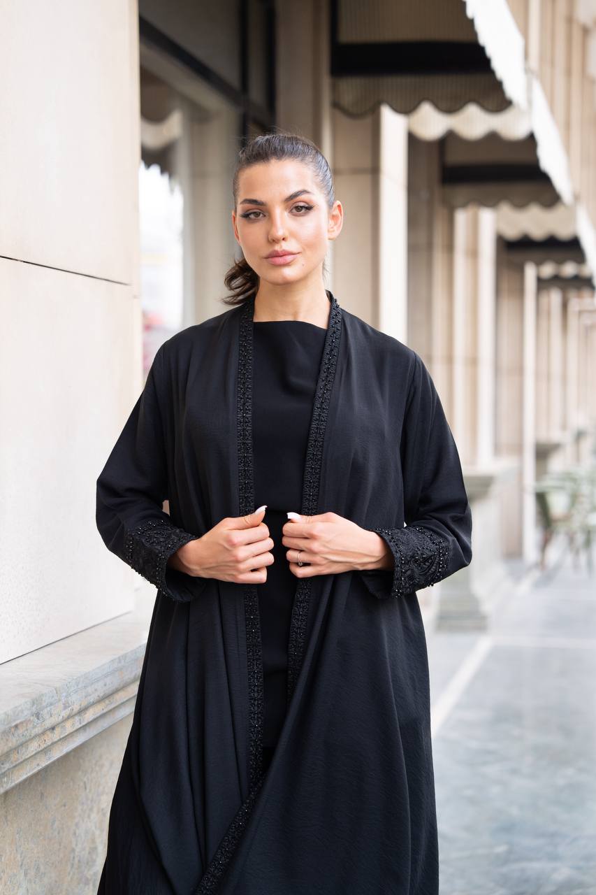 Linen abaya in black with hand embroidery and beading. C:1089